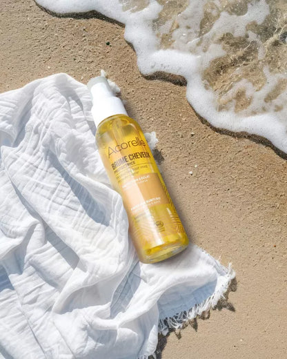Enrichie en huiles bio de Tournesol, Karanja et Buriti, cette brume biphasée protège les cheveux exposés au soleil et illumine les cheveux bouclés et frisés, pour qu'ils conservent toute leur beauté : éclat, brillance et douceur.